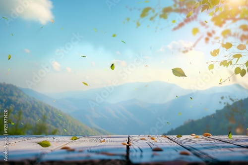 empty space table background for decoration and blurred mountain landscape. The sky is blue with sunlight and the small green leaves on the sides scatter and fall