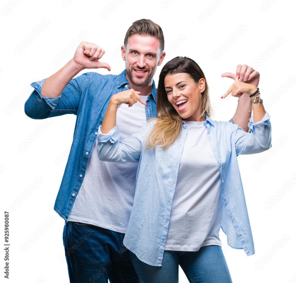 Fototapeta premium Young couple in love over isolated background looking confident with smile on face, pointing oneself with fingers proud and happy.