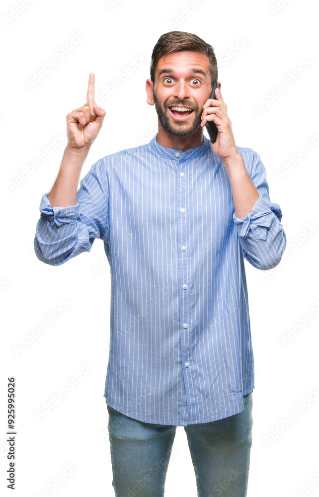 Young handsome man speaking on the phone over isolated background surprised with an idea or question pointing finger with happy face, number one Young handsome man speaking on the phone over isolated background surprised with an idea or question pointing finger with happy face, number one