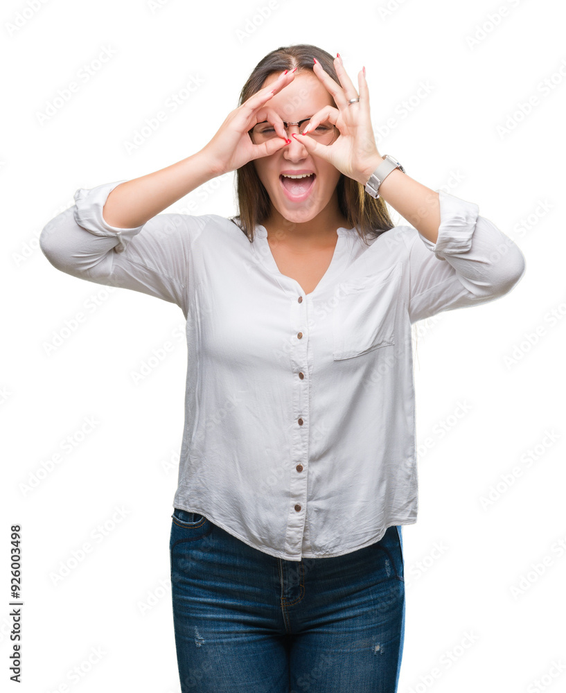 Young caucasian beautiful business woman wearing glasses over isolated background doing ok gesture like binoculars sticking tongue out, eyes looking through fingers. Crazy expression. Young caucasian beautiful business woman wearing glasses over isolated background doing ok gesture like binoculars sticking tongue out, eyes looking through fingers. Crazy expression.