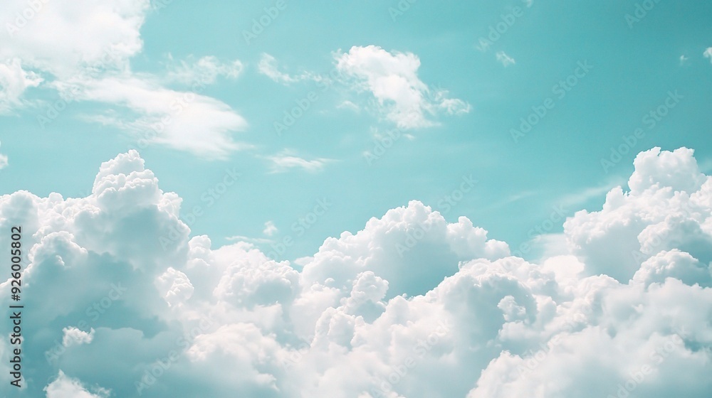 Celestial Dreamscape: A breathtaking view of fluffy white clouds drifting across a serene, teal sky. Perfect for evoking feelings of peace, tranquility, and limitless possibilities. Celestial Dreamscape: A breathtaking view of fluffy white clouds drifting across a serene, teal sky. Perfect for evoking feelings of peace, tranquility, and limitless possibilities.
