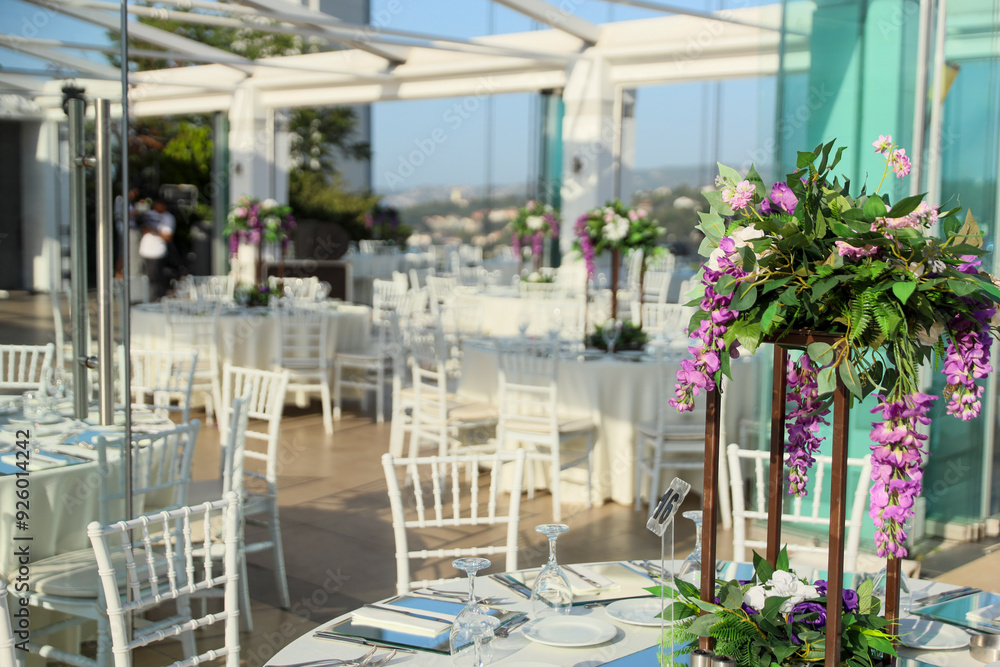 Elegant Outdoor Wedding Reception with Wisteria Floral Centerpieces