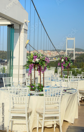 Elegant Outdoor Wedding Reception with Wisteria Floral Centerpieces