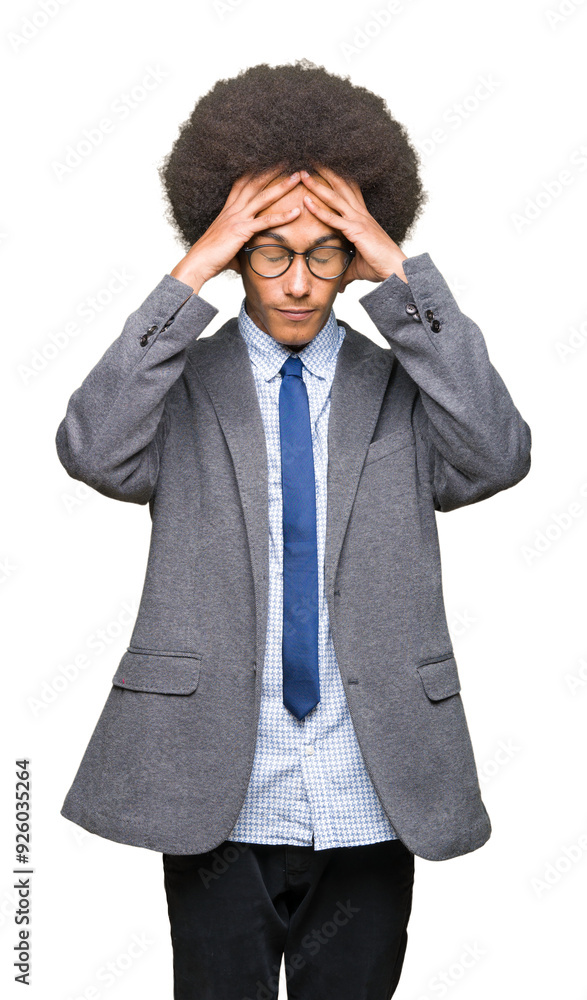 Young african american business man with afro hair wearing glasses suffering from headache desperate and stressed because pain and migraine. Hands on head. Young african american business man with afro hair wearing glasses suffering from headache desperate and stressed because pain and migraine. Hands on head.