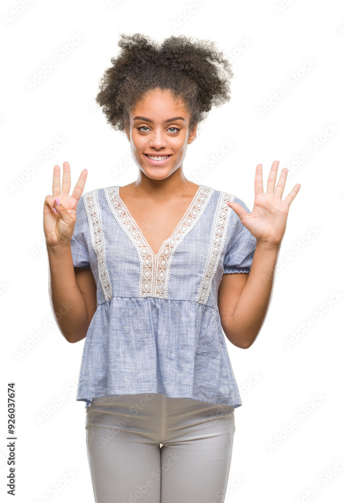 Young afro american woman over isolated background showing and pointing up with fingers number eight while smiling confident and happy. Young afro american woman over isolated background showing and pointing up with fingers number eight while smiling confident and happy.