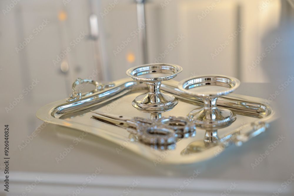 A set of elegant silver trays with ornate handles, perfect for serving tea or coffee A set of elegant silver trays with ornate handles, perfect for serving tea or coffee