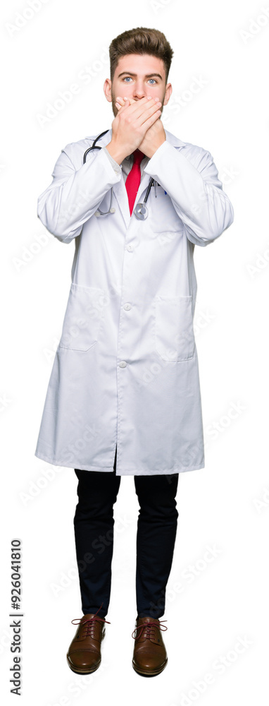 Young handsome doctor man wearing medical coat shocked covering mouth with hands for mistake. Secret concept. Young handsome doctor man wearing medical coat shocked covering mouth with hands for mistake. Secret concept.