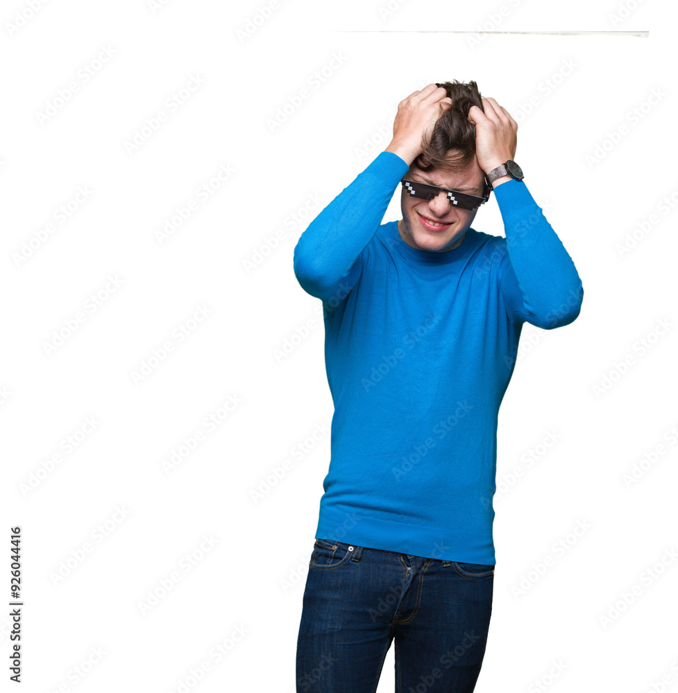 Young man wearing funny thug life glasses over isolated background suffering from headache desperate and stressed because pain and migraine. Hands on head. Young man wearing funny thug life glasses over isolated background suffering from headache desperate and stressed because pain and migraine. Hands on head.