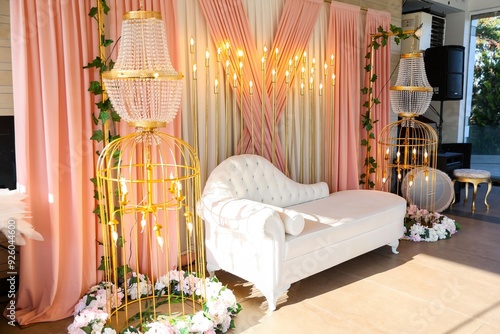 Obraz na płótnie Elegant wedding ceremony setup with a floral arch, a crystal chandelier, and a soft pink backdrop w salonie