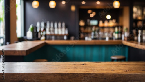 Empty the top of wooden table with blurred counter bar background. For montage product display