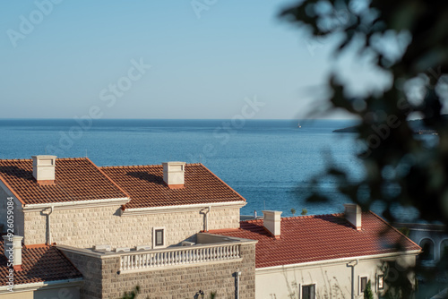 Luxury Mediterranean village on the coast of Adriatic Sea in Montenegro. Sunny day travel photos. Lustica bay town.  photo