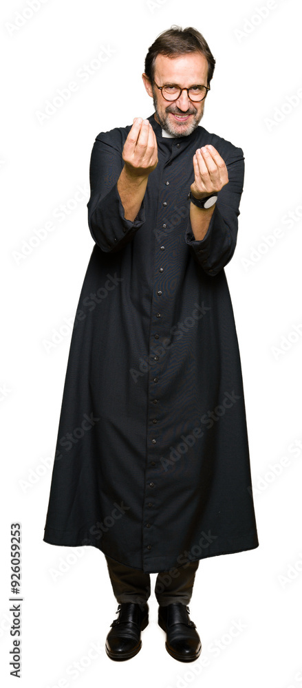 Middle age priest man wearing catholic robe Doing money gesture with hand, asking for salary payment, millionaire business Middle age priest man wearing catholic robe Doing money gesture with hand, asking for salary payment, millionaire business