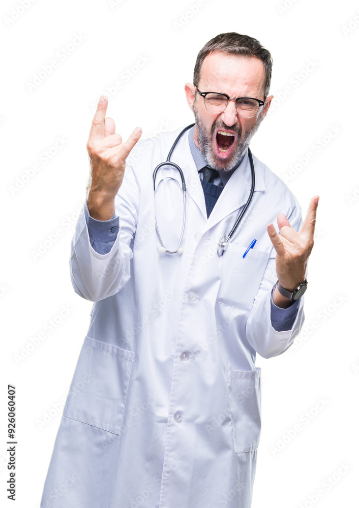 Middle age senior hoary doctor man wearing medical uniform isolated background shouting with crazy expression doing rock symbol with hands up. Music star. Heavy concept. Middle age senior hoary doctor man wearing medical uniform isolated background shouting with crazy expression doing rock symbol with hands up. Music star. Heavy concept.
