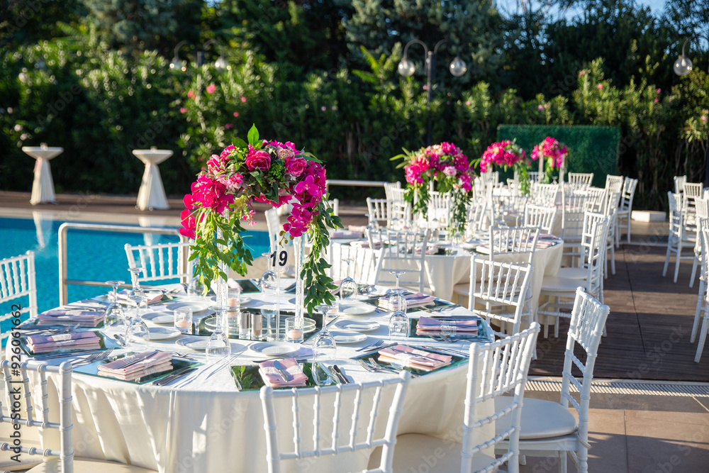 Indoor Wedding Reception: Round Table with White Flowers and Crystal Accents