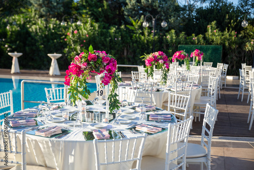 Indoor Wedding Reception: Round Table with White Flowers and Crystal Accents