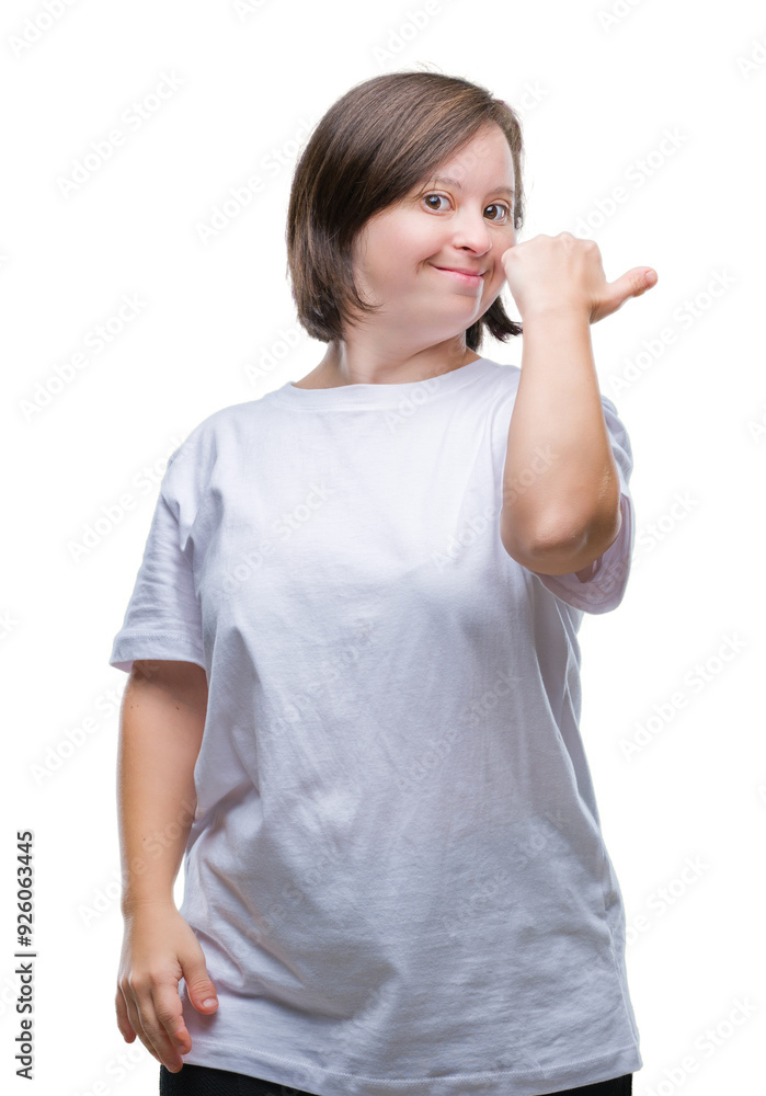 Young adult woman with down syndrome over isolated background smiling with happy face looking and pointing to the side with thumb up. Young adult woman with down syndrome over isolated background smiling with happy face looking and pointing to the side with thumb up.