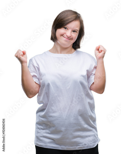 Young adult woman with down syndrome over isolated background celebrating surprised and amazed for success with arms raised and open eyes. Winner concept.