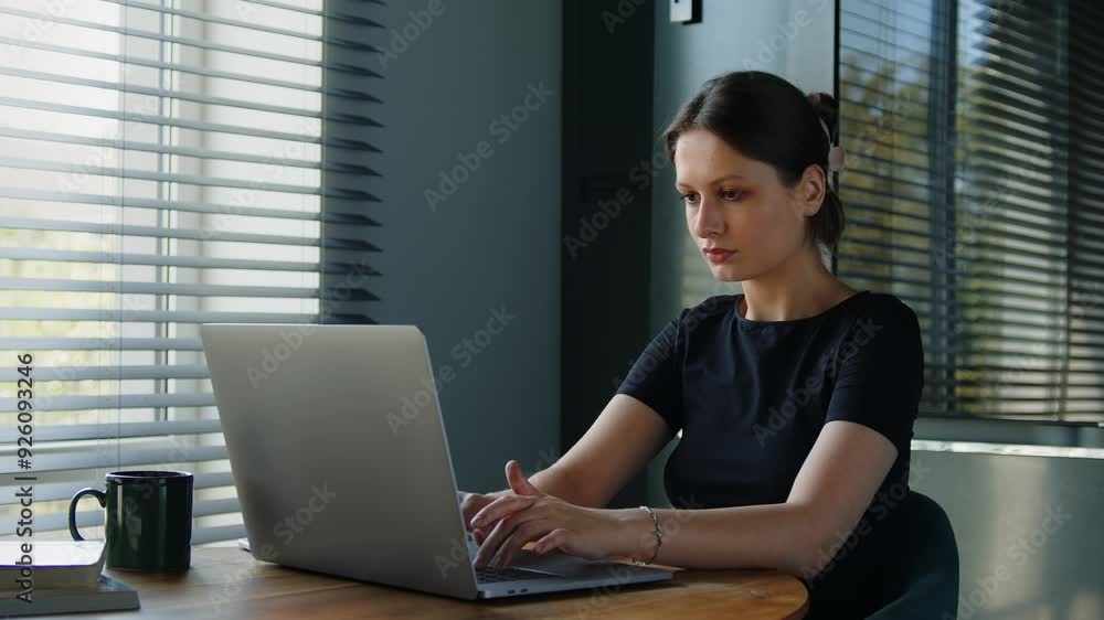 Young business woman typing on laptop computer working in internet, beautiful female professional user lady using pc technology doing online job in home office. Young business woman typing on laptop computer working in internet, beautiful female professional user lady using pc technology doing online job in home office.