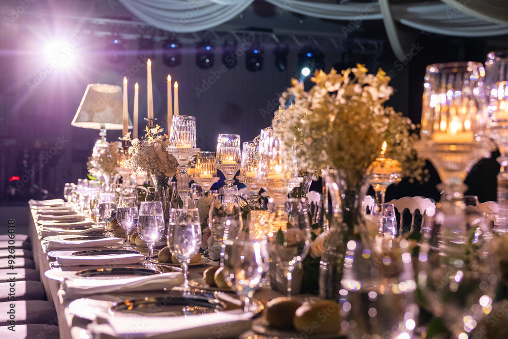 Elegant Wedding Table Setting with Candles and Floral Centerpieces