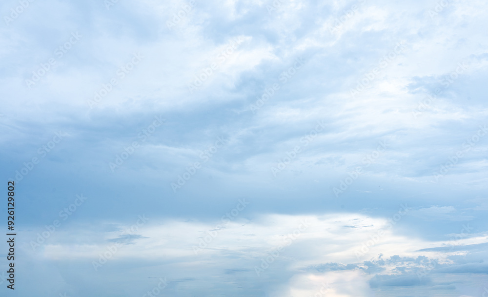 Fluffy cumulus clouds drifting across a bright blue sky Fluffy cumulus clouds drifting across a bright blue sky