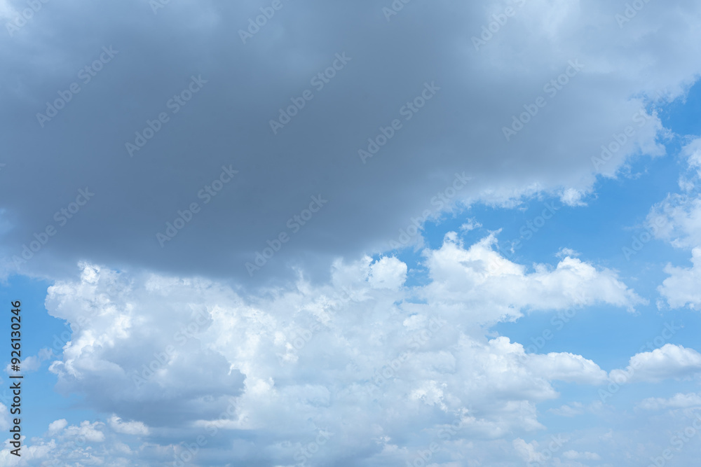Fluffy white clouds drifting across a bright blue summer sky Fluffy white clouds drifting across a bright blue summer sky