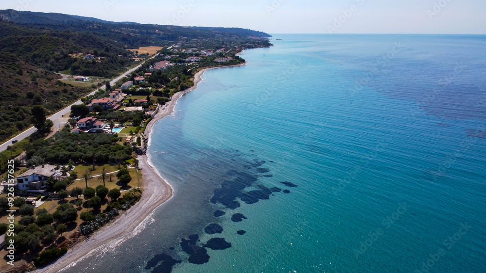 Greek beach near the city of Thessaloniki, The photo shows a resort area with a beautiful beach and crystal clear water Greek beach near the city of Thessaloniki, The photo shows a resort area with a beautiful beach and crystal clear water