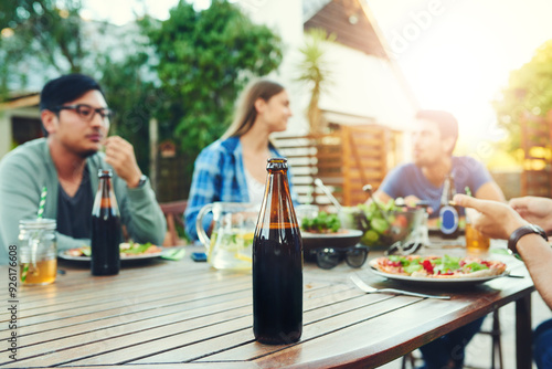 Lunch, beer and group with food, outdoor and gathering for reunion with friends, backyard and eating. House, hands and plate of salad in weekend, yard and party for vegan, hungry or brunch for people