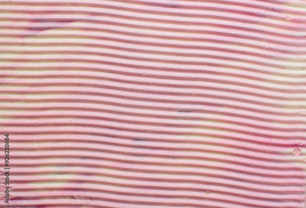 Top view of pink and cream buttercream for decorating cake, silky smooth american buttercream with patterns, overhead view of smooth buttercream Top view of pink and cream buttercream for decorating cake, silky smooth american buttercream with patterns, overhead view of smooth buttercream