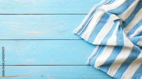 Striped Kitchen Towel on Light Blue Wooden Table Top