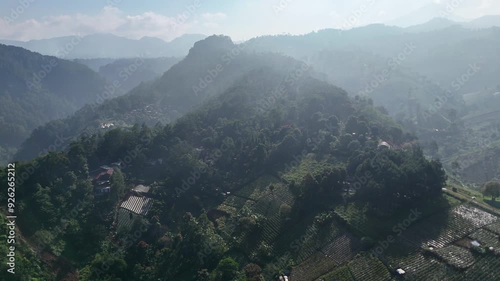 Aerial view of farms in the hills of Bandung Indonesia with a slow zoom out. Aerial view of farms in the hills of Bandung Indonesia with a slow zoom out.