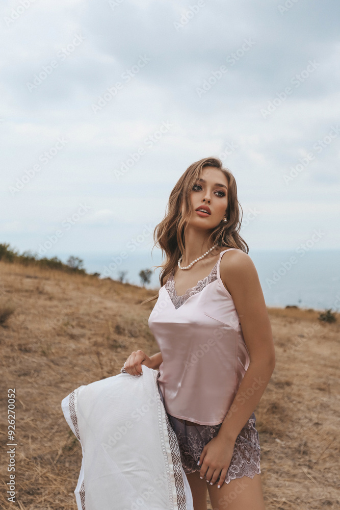 beautiful woman with blond hair in elegant silk lingerie beautiful woman with blond hair in elegant silk lingerie