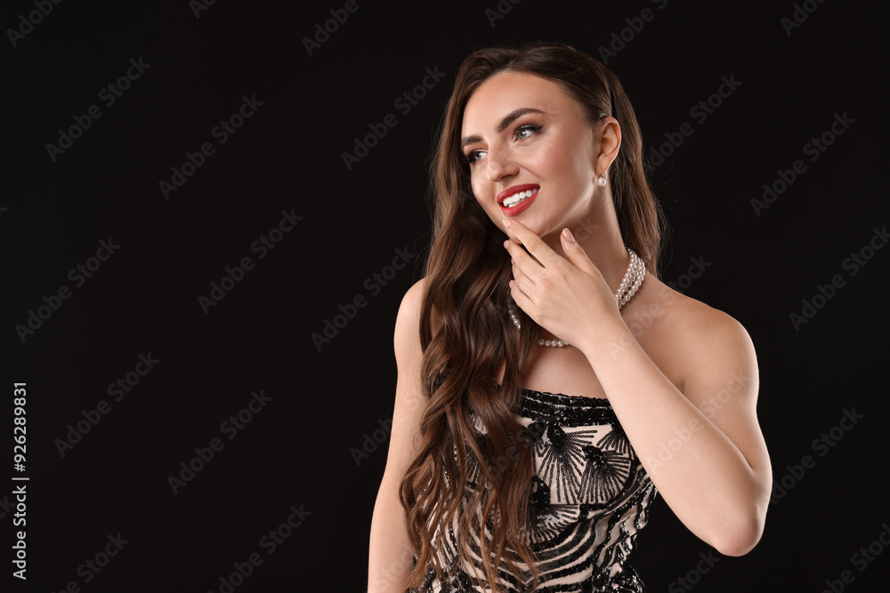 Portrait of smiling woman on black background. Space for text Portrait of smiling woman on black background. Space for text
