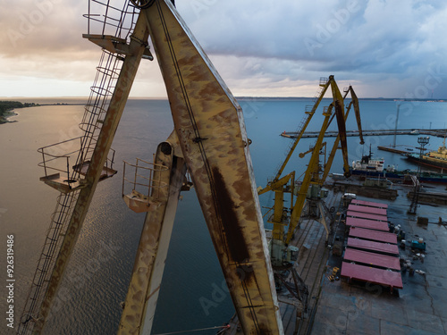 Old Cranes in the cargo port in Kopli at sunset on a summer evening, photo view from a drone. photo