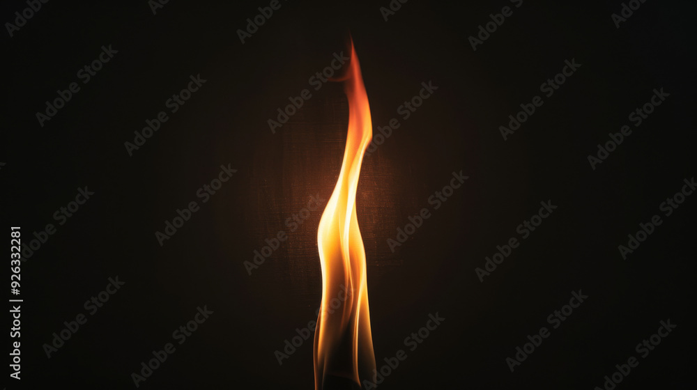 Single Flame Burning Brightly Against a Black Background, Vibrant Colors from Crimson to Yellow Single Flame Burning Brightly Against a Black Background, Vibrant Colors from Crimson to Yellow