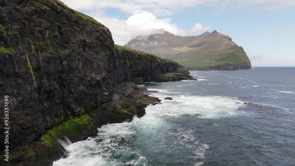 drone video, bird's-eye view, sea, rocky coast of the Faroe Islands drone video, bird's-eye view, sea, rocky coast of the Faroe Islands
