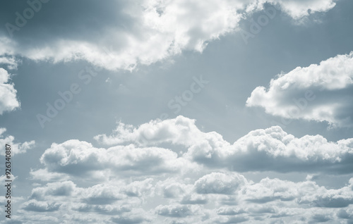 Dramatic overcast sky with gray clouds forming moody and tranquil backdrop before rain, capturing the serene yet stormy atmosphere in the cloudy weather of the rainy season. Moody and peaceful scene.