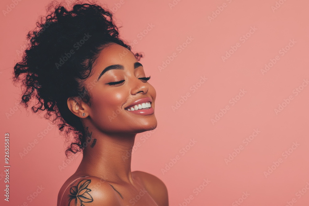 A close up of a tattooed black woman's face with her eyes closed A close up of a tattooed black woman's face with her eyes closed