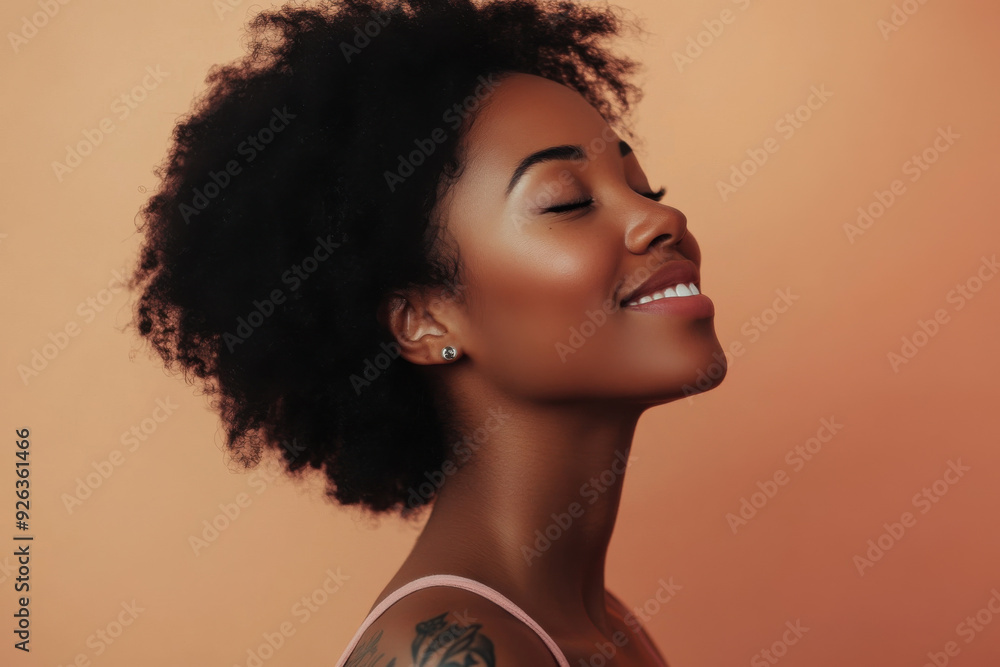 A close up of a tattooed black woman's face with her eyes closed A close up of a tattooed black woman's face with her eyes closed