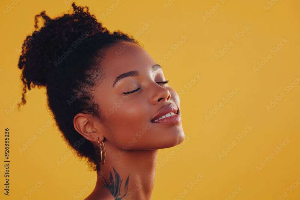 A close up of a tattooed black woman's face with her eyes closed A close up of a tattooed black woman's face with her eyes closed