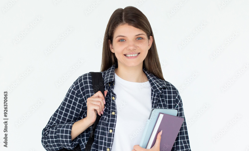 Caucasian girl student in blue shirt with folder, books, notebook, notepad in hands smiling isolated on white studio background, copy space Caucasian girl student in blue shirt with folder, books, notebook, notepad in hands smiling isolated on white studio background, copy space