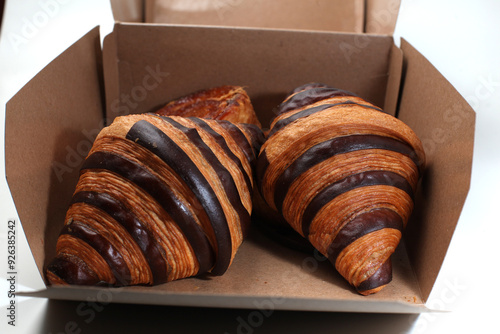 one box of croisants and cromboloni bread, good for recipes and articles photo