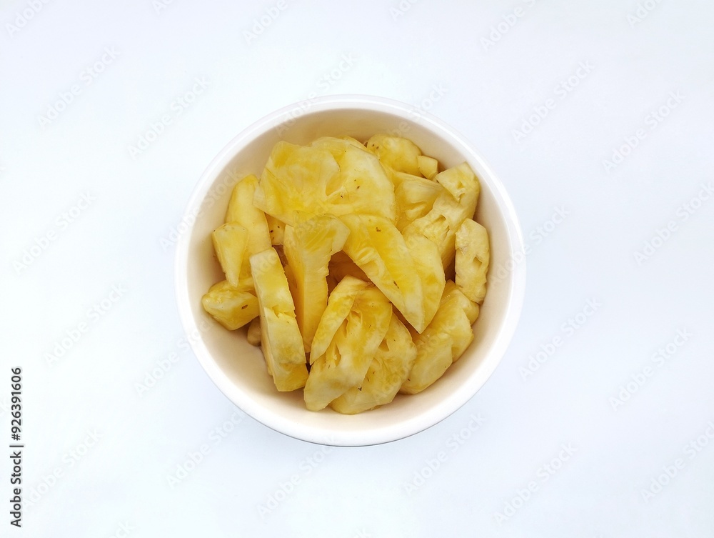 Fresh pineapple pieces in bowl isolated on white background Fresh pineapple pieces in bowl isolated on white background