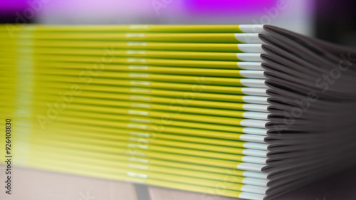 Stitched stapling printing brochures report in the bookbindery or print shop. Print paper sorted with spine. Lettershop or bookbinder.
