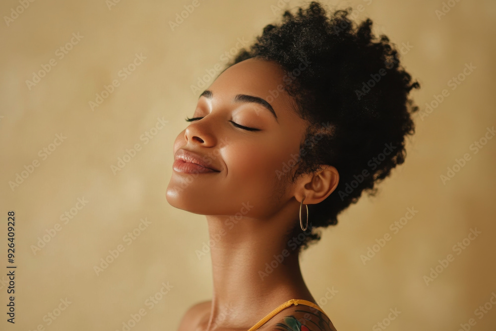 A close up of a tattooed black woman's face with her eyes closed A close up of a tattooed black woman's face with her eyes closed