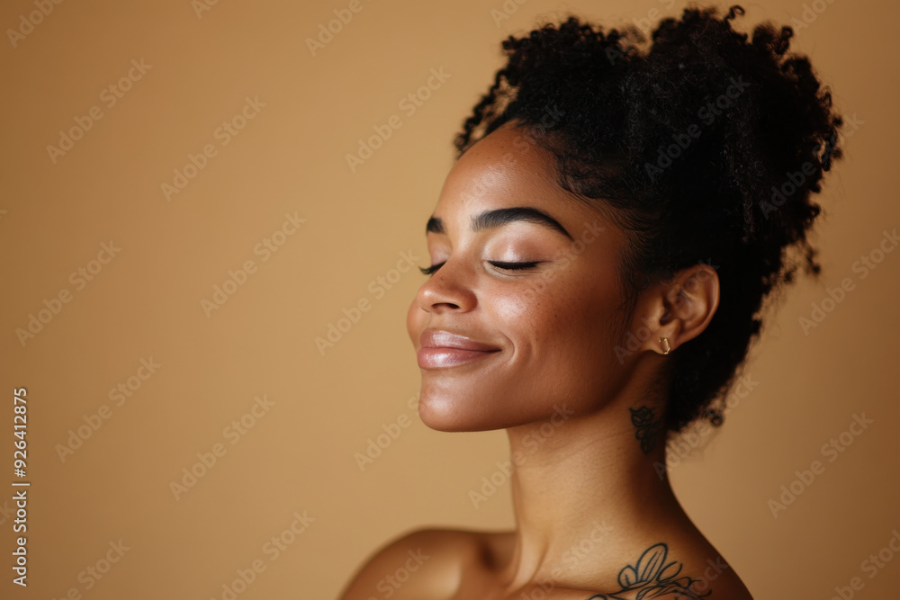 A close up of a tattooed black woman's face with her eyes closed A close up of a tattooed black woman's face with her eyes closed