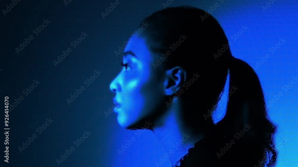 A woman's face expressed with a digital dot pattern A woman's face expressed with a digital dot pattern