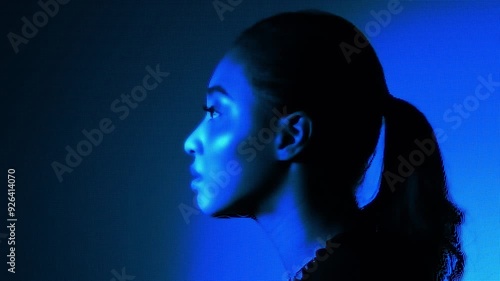 A woman's face expressed with a digital dot pattern