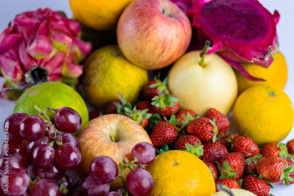 Various ripe fruits and berries in the background, top view Various ripe fruits and berries in the background, top view