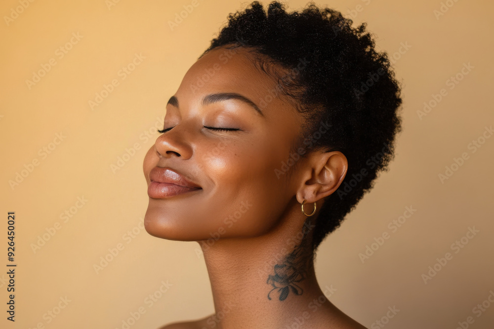 A close up of a tattooed black woman's face with her eyes closed A close up of a tattooed black woman's face with her eyes closed