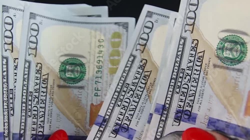 Dollars, American banknotes value of 100, rotate. Close-Up of banknotes. Hundred dollar bill close up in camera motion. Dollars money. 100 dollars Us